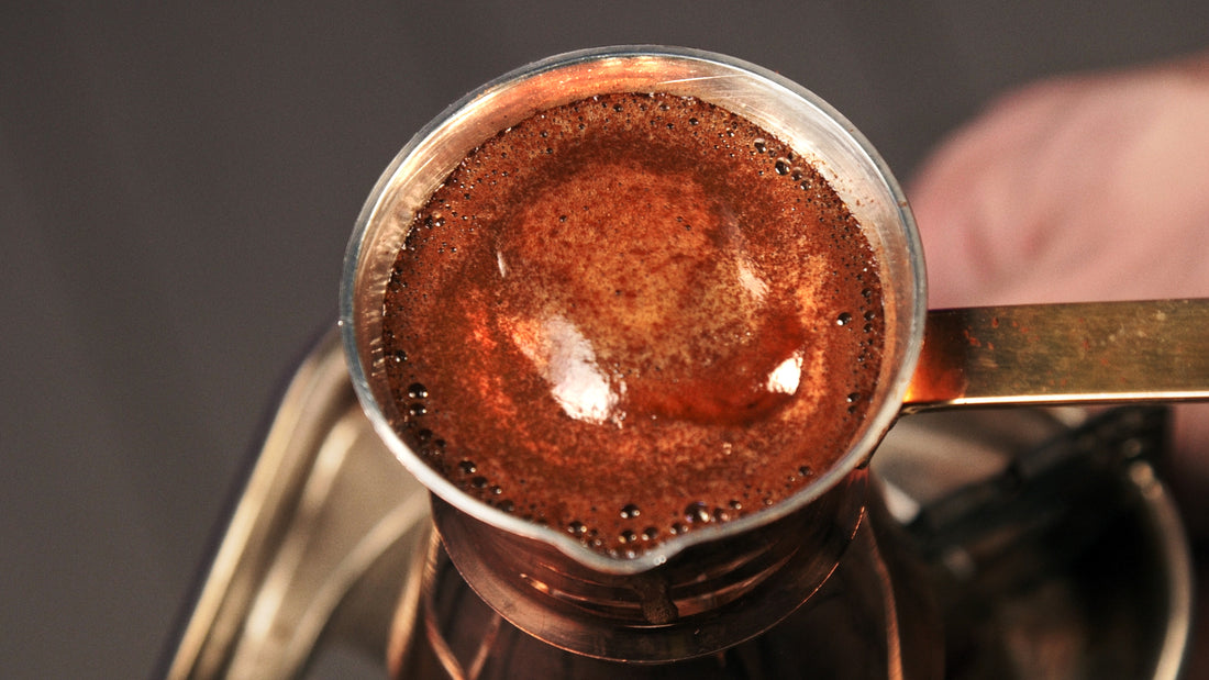 Beautiful Turkish coffee foam in copper cezve